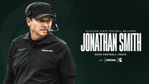 Jonathan Smith looking on with text that says "Michigan State football welcomes Jonathan Smith."